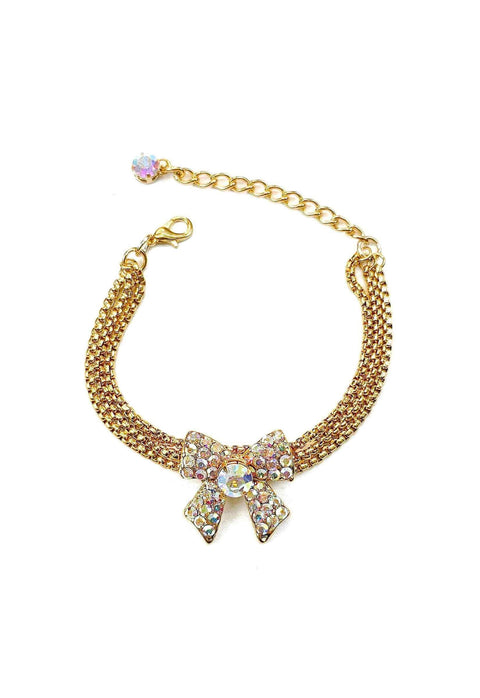 Pulseira Samira gold com pingente de laço boreal e correntes venezianas