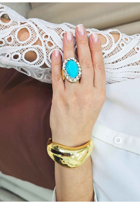 Anel Julieta dourado com pedra oval azul e strass cristal