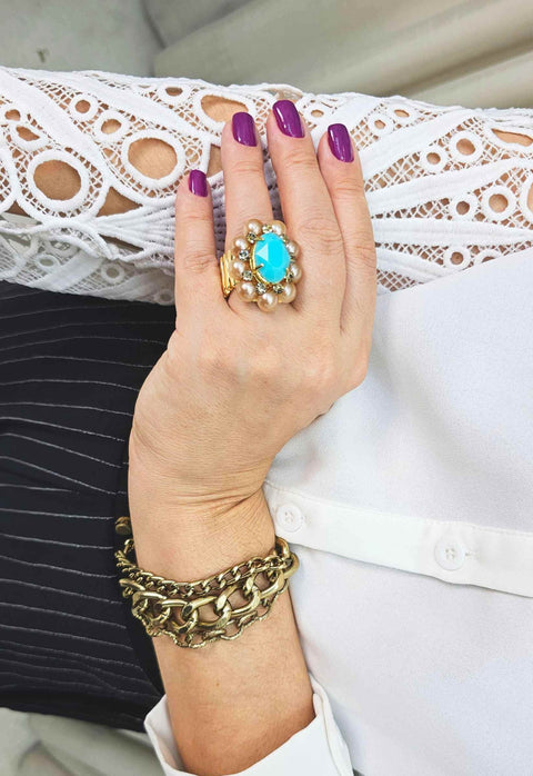 Anel Donatela luxuoso com pedra azul e black diamond banhado no dourado