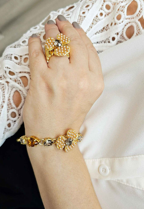 Pulseira Florência com pingente de flor e pedras champagne