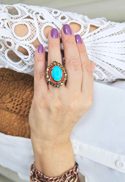 Anel Ambaris com pedra azul e strass coral e marrom