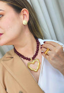 Colar Alma com pingente de coração dourado e bolas vermelhas