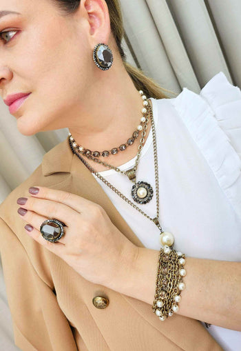 Pulseira Sucesso ouro velho com perolas e pedras black diamond