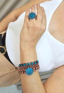 Anel Atalia redondo com pedras blue zircon