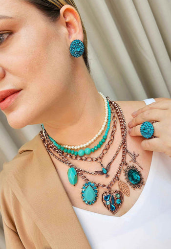 Anel Atalia redondo com pedras blue zircon
