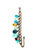 Pulseira Mocha blue com pedras azuis e marrons banhado no ouro velho