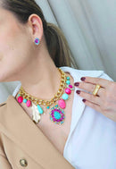 Brinco Babalu rosa e azul banhado no dourado
