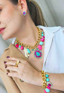 Brinco Babalu rosa e azul banhado no dourado