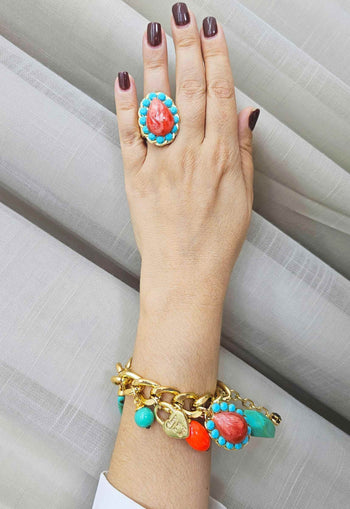 Anel Brisa Tropical com pedras turquesas e coral banhado no dourado