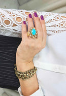 Anel Donatela luxuoso com pedra azul e black diamond banhado no dourado