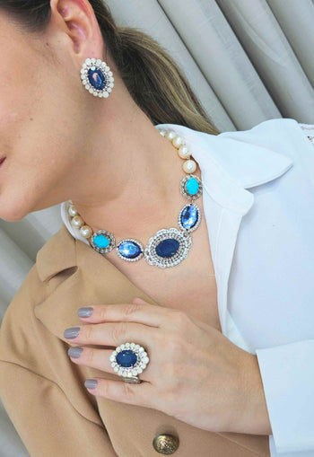 Anel Aconchegar com pedra azul e strass opal banhado no prata