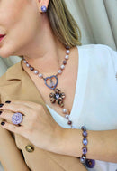 Brinco Apaixonante banhado no vintage com pedras lavanda