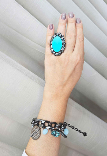 Anel Conexão oval com pedra azul e hematite banhado no grafite