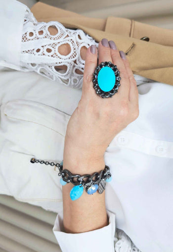 Anel Conexão oval com pedra azul e hematite banhado no grafite