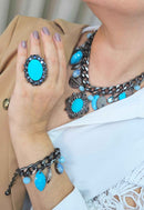 Anel Conexão oval com pedra azul e hematite banhado no grafite