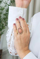 Anel Tessália oval com pedra coral e Light Peach banhado no dourado
