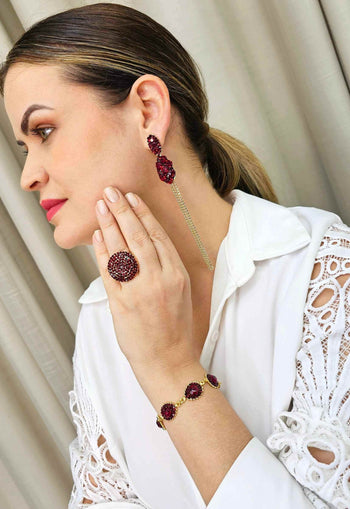 Pulseira Rubi Glam dourada com pedras vermelhas
