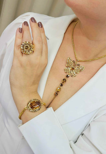 Anel Angelita Gold redondo com pedras douradas