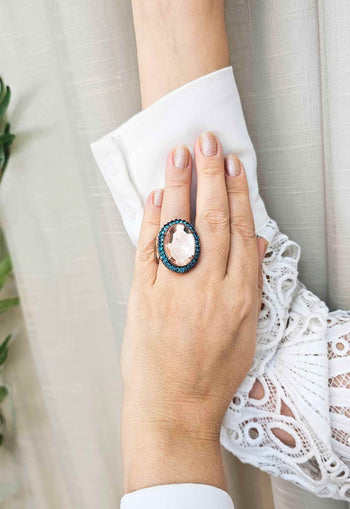 Anel Paloma oval de pedra peach com azul banhado no vintage