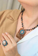 Anel Paloma oval de pedra peach com azul banhado no vintage