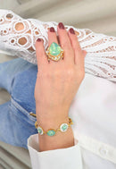 Anel Euforia de pedras verde menta e strass cristal banhado no dourado