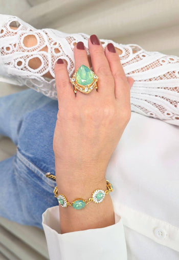 Anel Euforia de pedras verde menta e strass cristal banhado no dourado