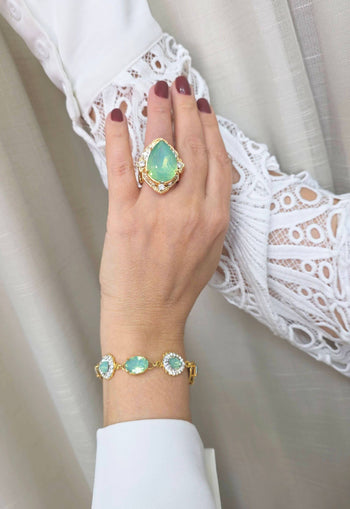 Anel Euforia de pedras verde menta e strass cristal banhado no dourado