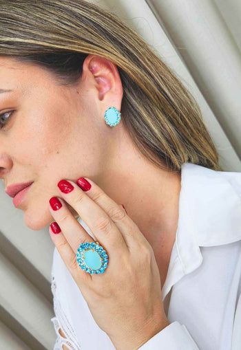 Anel Oásis oval de pedras azuis banhado no dourado