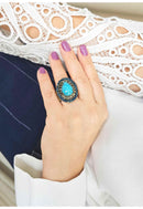 Anel Antônia oval de pedras azuis e black diamond banhado no ouro velho