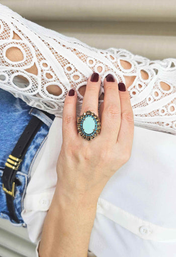 Anel Radiância com pedras marrons e tons de azuis banhado no vintage