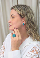 Brinco Noir pequeno de pedras blue zircon banhado no ouro velho