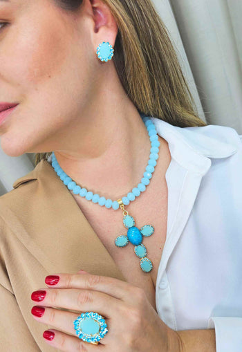 Brinco Oásis oval de pedras azuis banhado no dourado