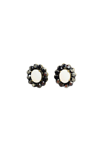 Brinco Fascínio oval com pedras brancas e hematite banhado no ouro velho