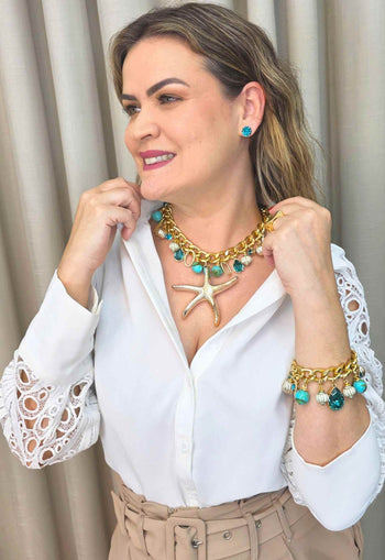 Brinco Beira-Mar de pedras azul turquesa banhado no dourado