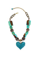 Colar Noir de pedras marrom e verde com pingente de coração blue zircon banhado no ouro velho