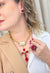 Colar Ester Vermelho com pingente de cruz banhado no dourado