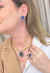 Colar Charline com pingente de gota de pedras ametista, azul e black diamond banhado no dourado