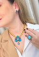 Colar Paola Turquesa: Moderno com Pedras Azuis e Correntaria no Dourado | Destaque no seu Look
