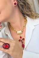 Anel Kalani Oval com pedras vermelhas banhado no dourado