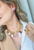 Colar Pétala com pingente de flor e pedras rosa e black diamond banhado no dourado