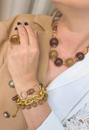 Pulseira Acervo: Mix de Elos com Bolas e Pedras em Tons Marrom no Dourado | Peça Exclusiva