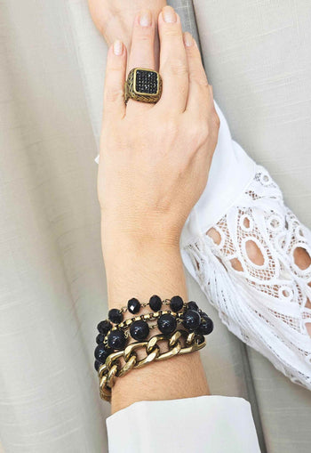 Pulseira Cândida ouro velho com pedra pretas