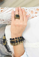 Pulseira Cândida ouro velho com pedra pretas