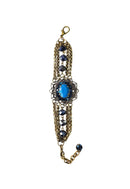 Pulseira Melodia de pedras azul com pingente ouro velho